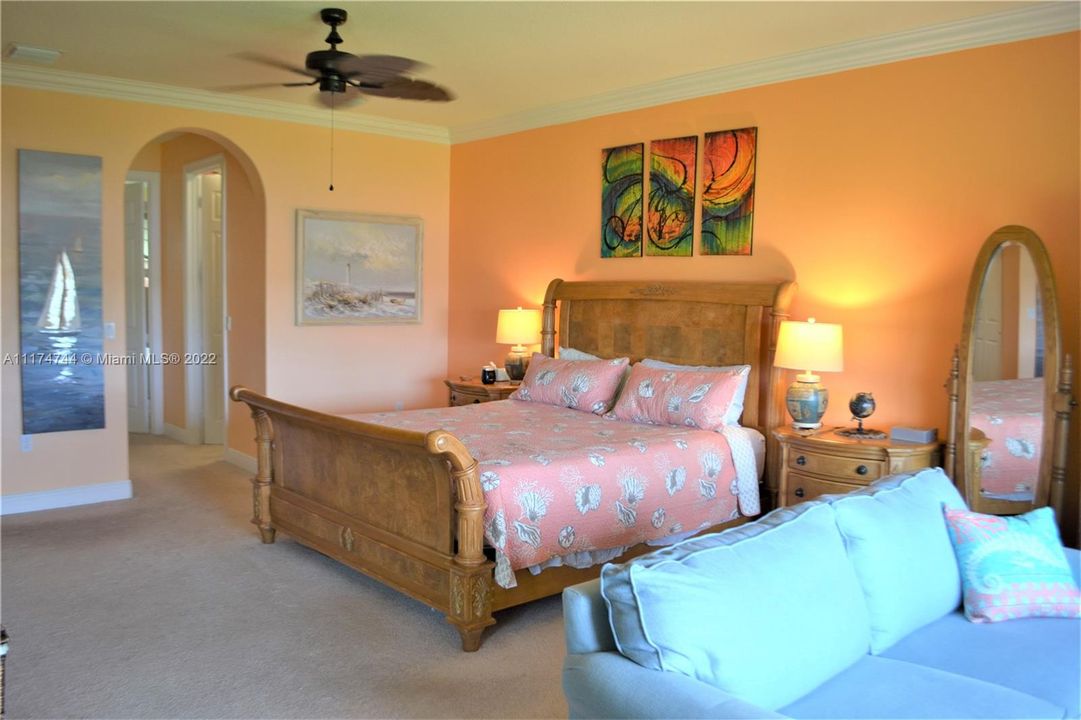 Oversized master suite with sitting area to watch the lake and natural bird life.