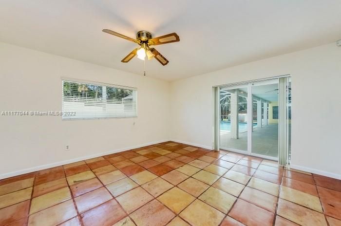 The Master Suite also has sliding glass doors opening to the Pool-Patio and has Mexican tile floors! Very nice Masterbath!