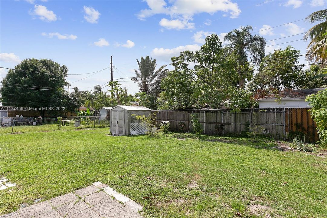 Huge fenced backyard with room for pool & for planting fruit trees