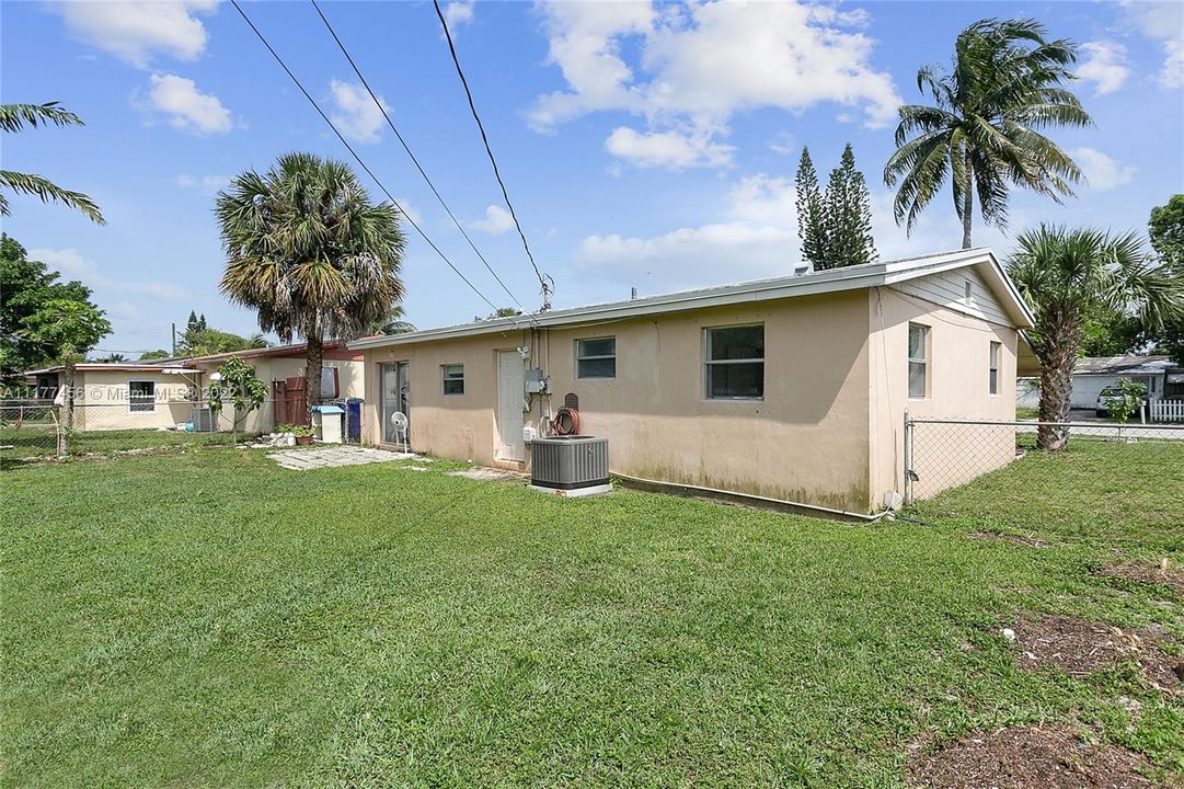 Huge fenced backyard with room for pool & for planting fruit trees