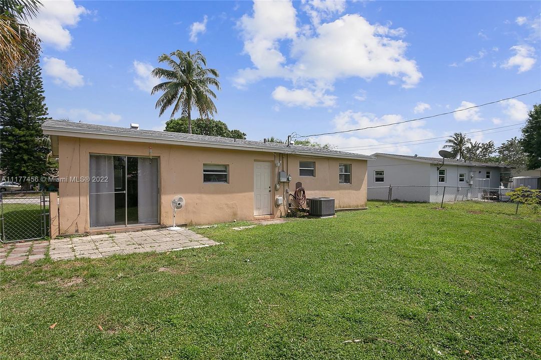 Huge fenced backyard with room for pool & for planting fruit trees