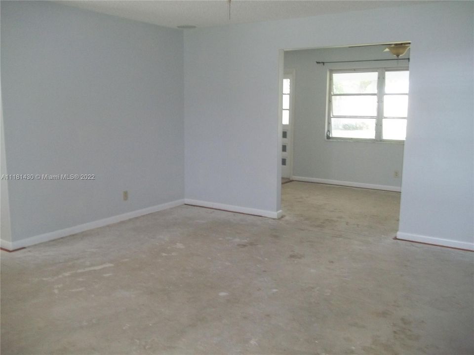 Living room opens onto family room