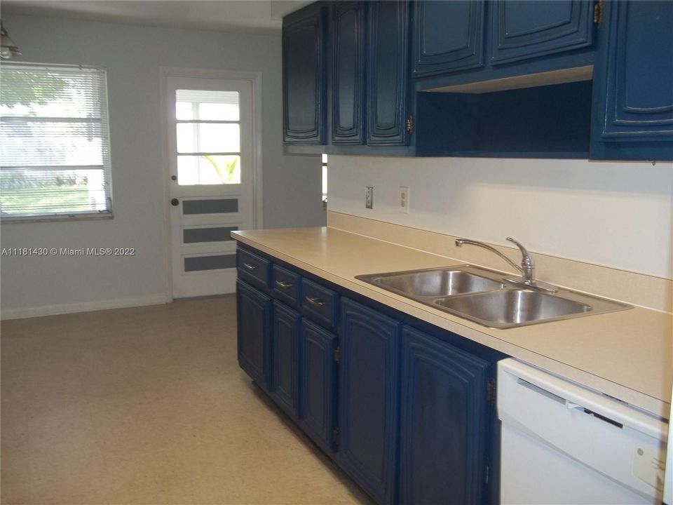 Kitchen opens onto breakfast area & dining room