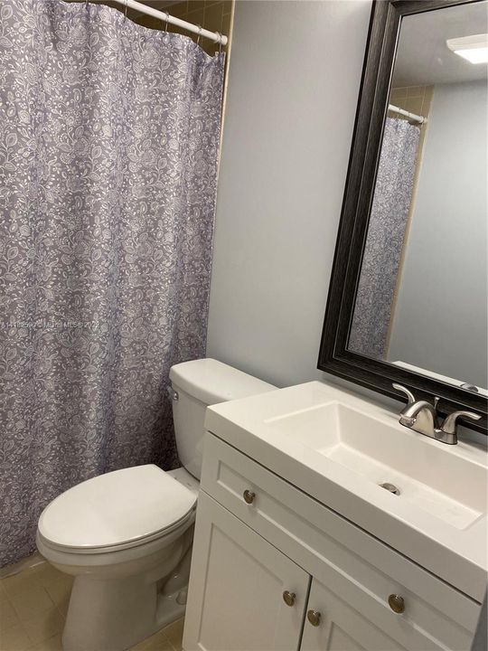 Guest bathroom with tub. Brand new toilet