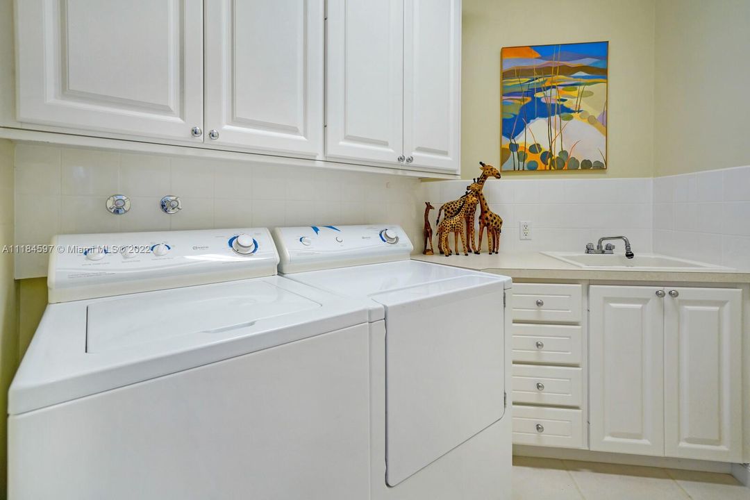 laundryroom with built ins and sink