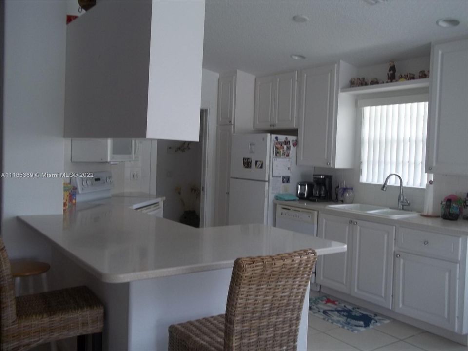 Kitchen w/corian countertops/snack bar