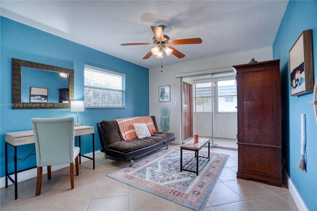 Second bedroom with access to screened in porch.