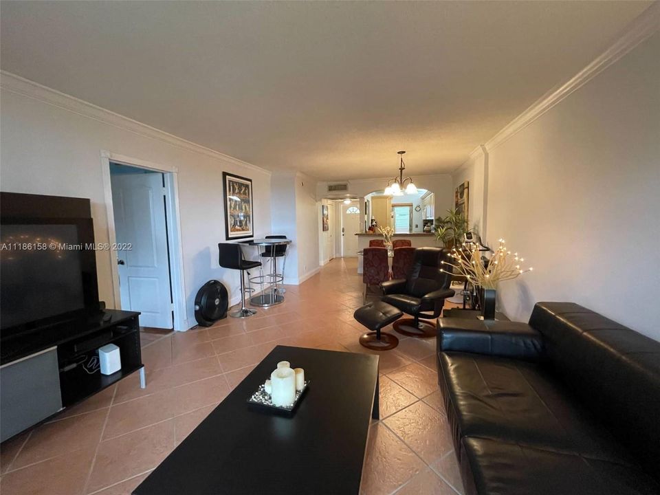 View of the Main Living Room and Dining Room from the  Rear Sliding Glass Doors