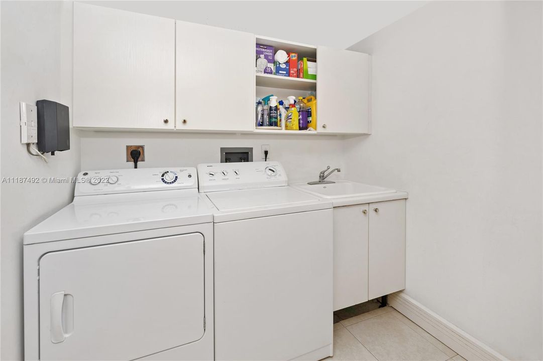 Full Laundry Room with sink