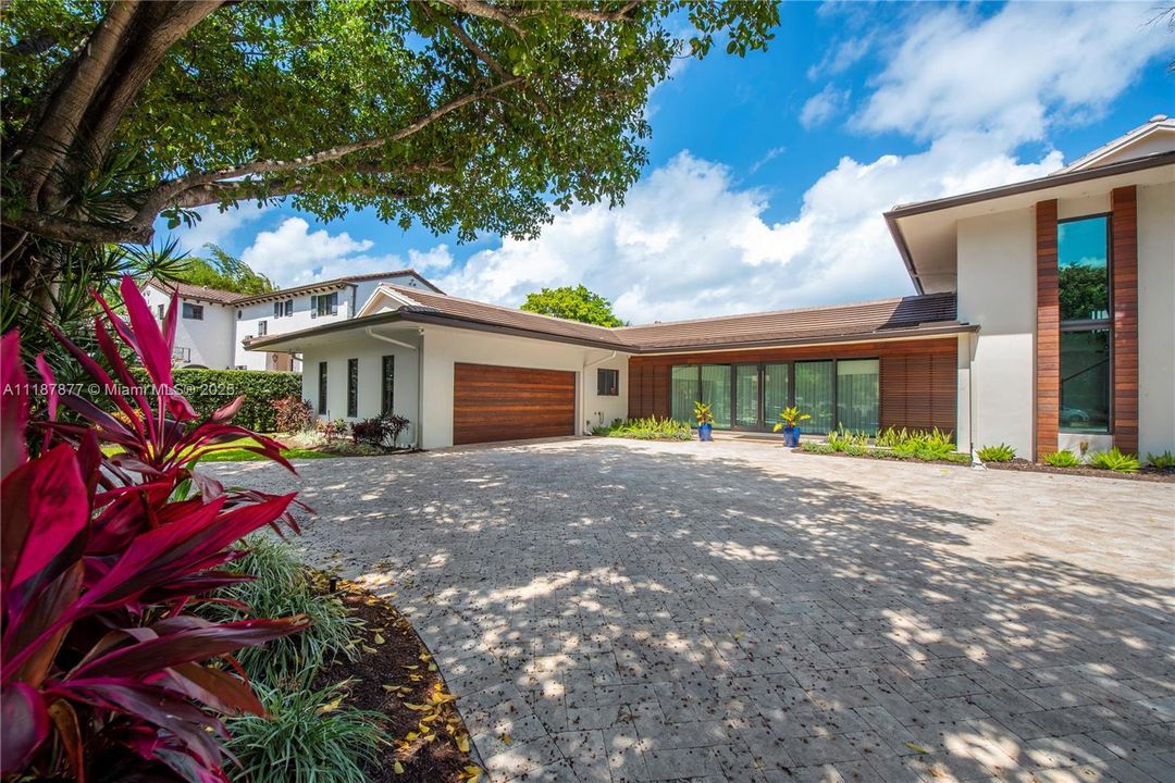 Garden framed drive under blue skies