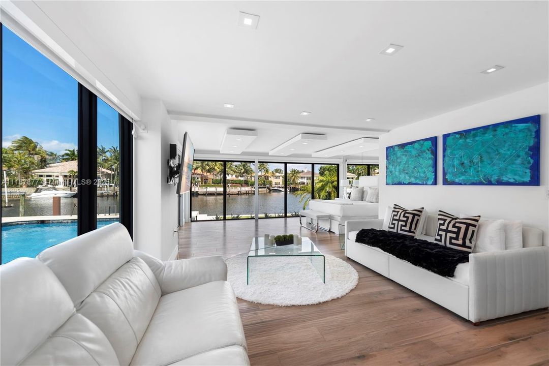 Living room with mural and water views