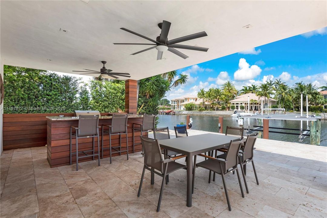 Patio dining with fans and sunset views