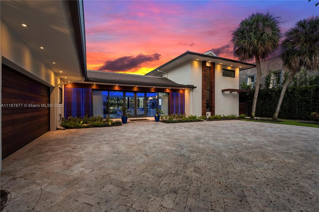 Twilight entry with warm welcome glow