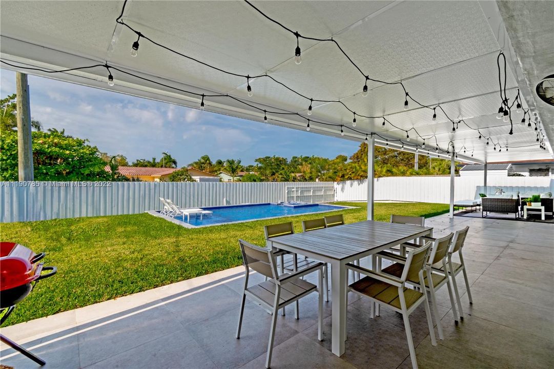 Huge backyard with covered a large area for dining, lounge and entertain. All new fencing!