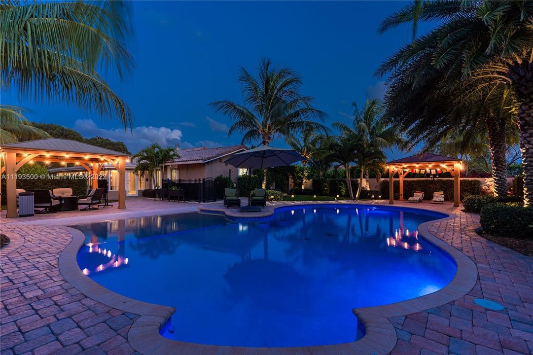 Evening view of amazing pool and the 2 pergolas