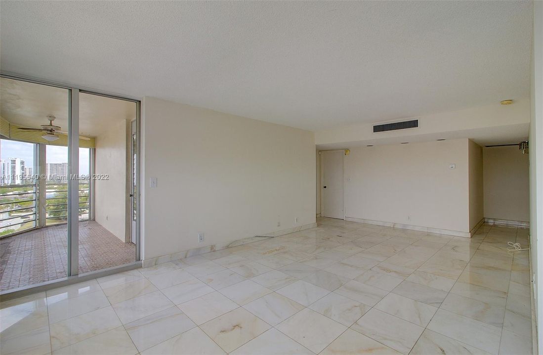 LIVING ROOM LOOK TO THE BALCONY AND BEDROOMS