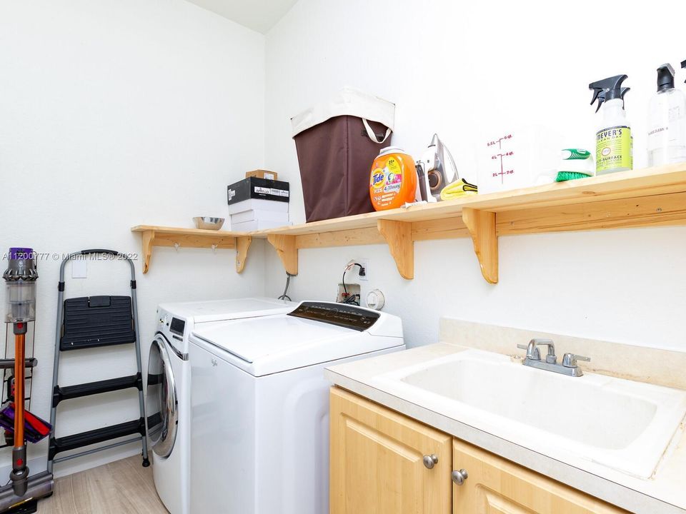 Large Inside Utility Room. Sink, Shelves, Cabinets