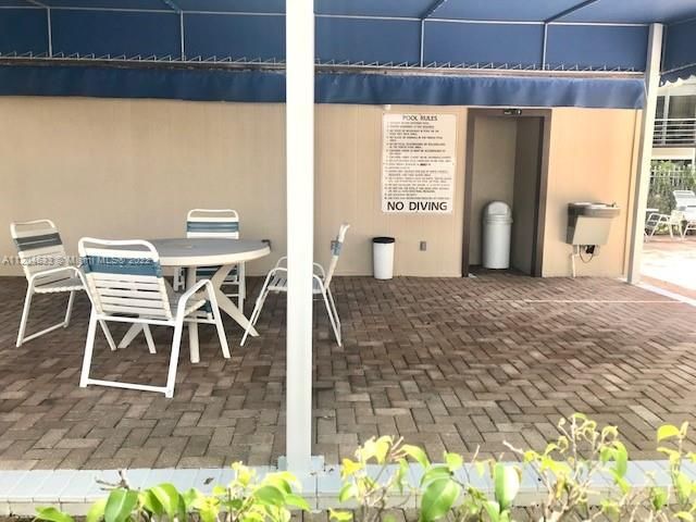 tables and sitting area near 2nd pool