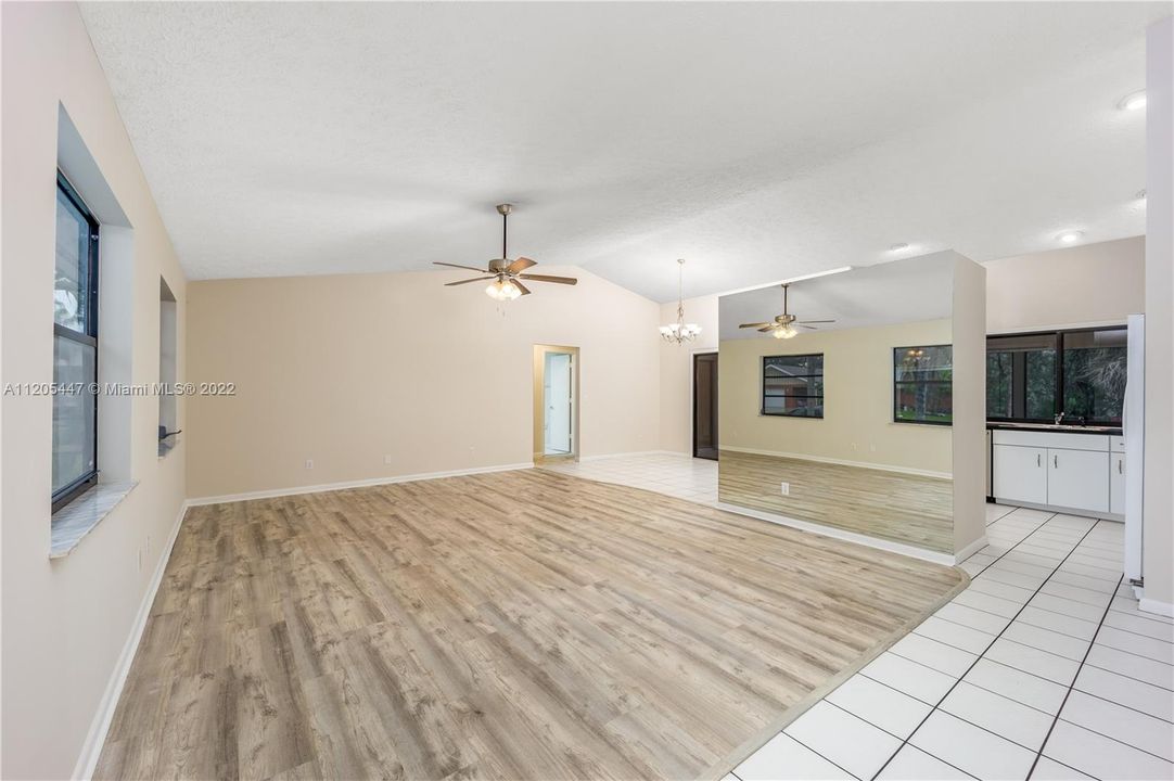 Enter the home through the front door into the foyer/living room