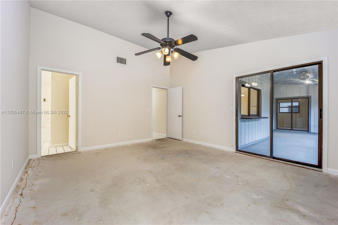 Main Bedroom with Sliders leading outdoor to Florida Room