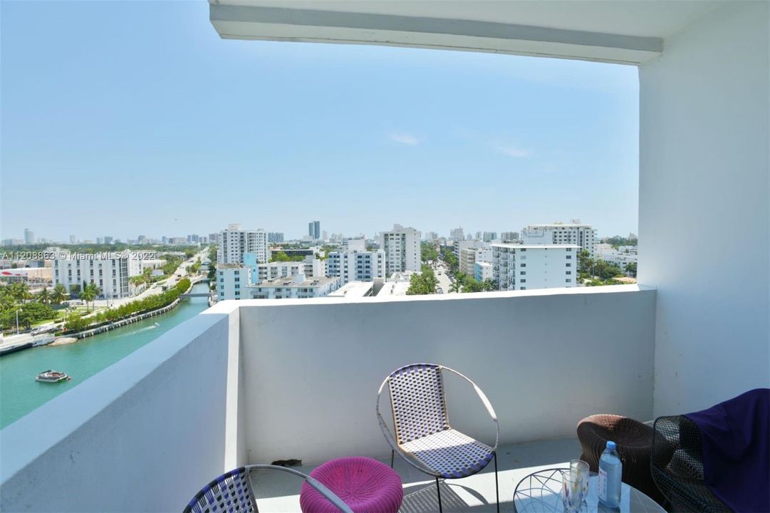 Relax on your intimate balcony with 180-degree views of Miami Beach and the City