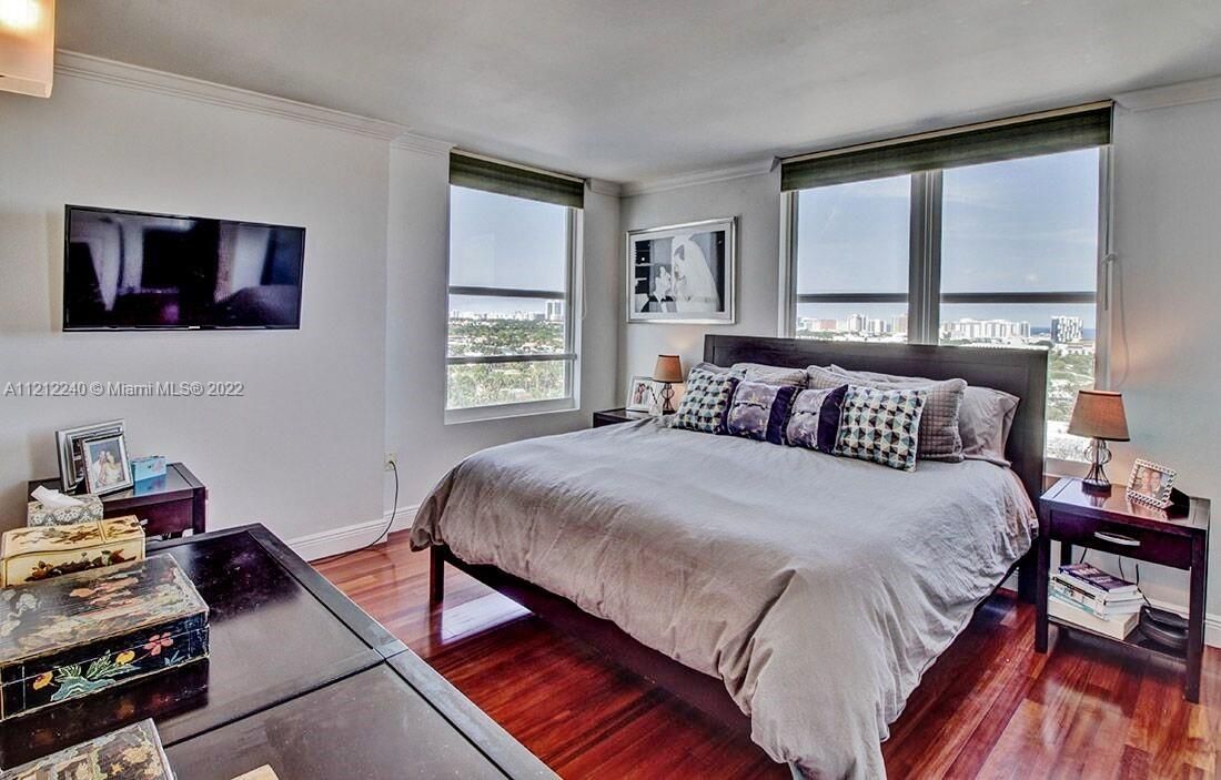 Large master bedroom with stunning 180 degree views, balcony access, 3 upgraded closets and attached en suite bathroom.