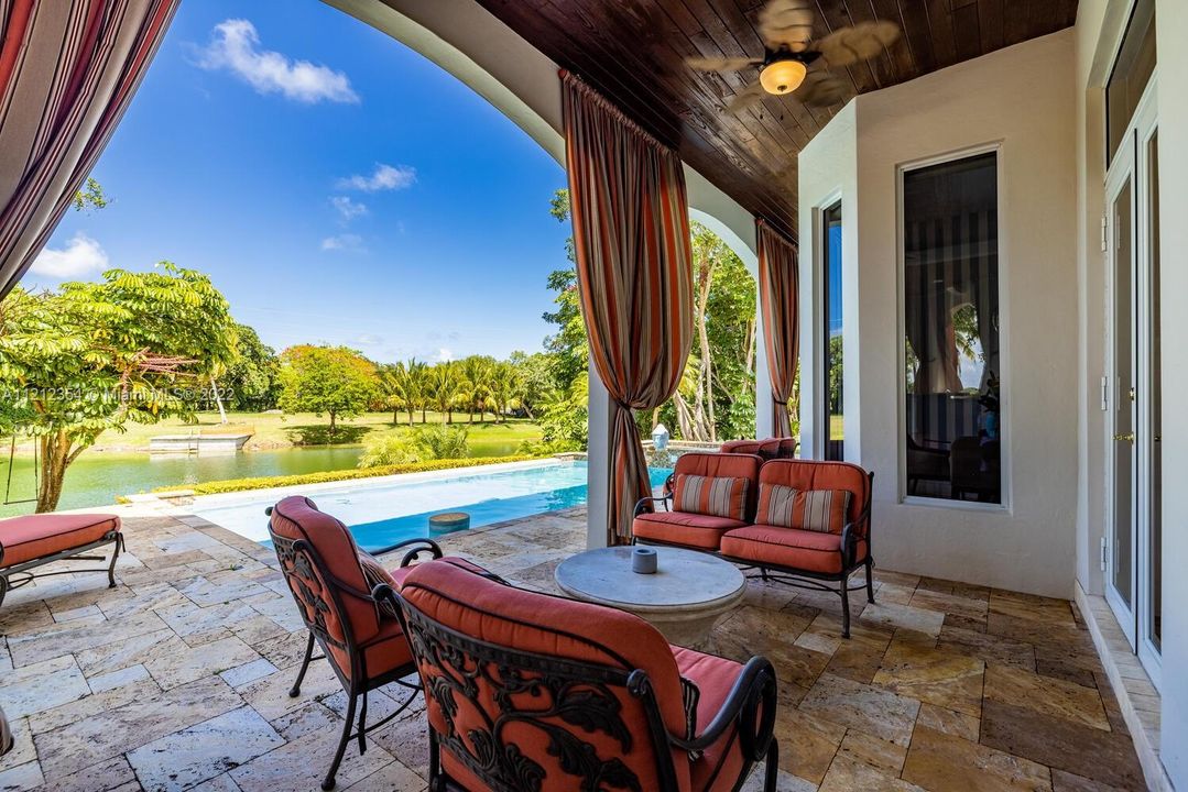 Sit al fresco with relaxing views to pool and lake.