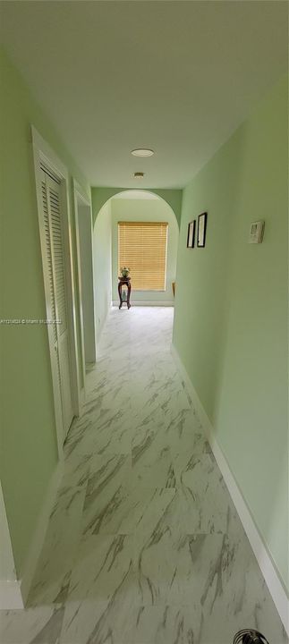 Hallway to garage and formal dining room