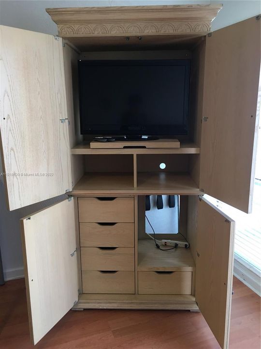 Another wardrobe for extra storage and TV
