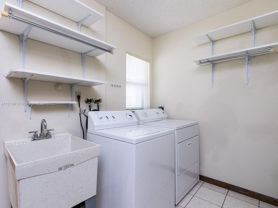 Laundry Room with large pantry next to kitchen