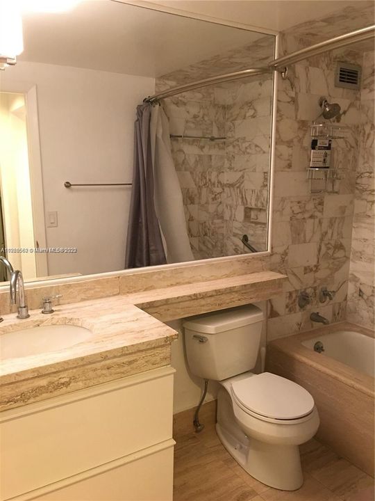 Nice marble bathroom with tub and shower combination