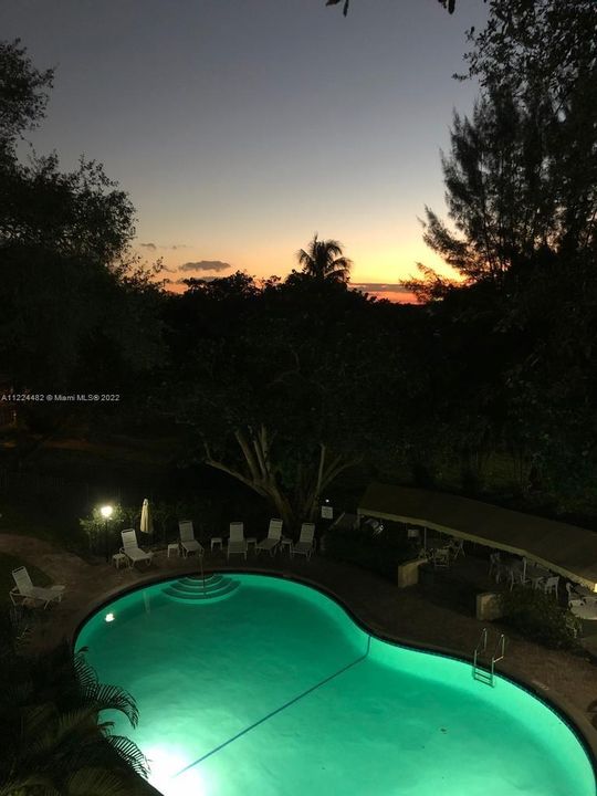night view of pool from bedroom
