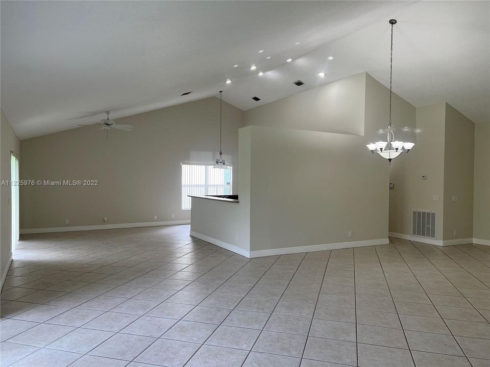 Living room and dining room looking towards family room and kitchen