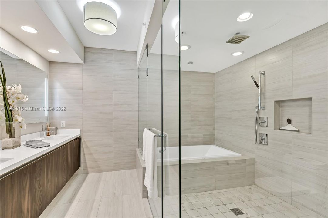 Primary Bath with Dual Backlit Vanities and Enclosed Shower/Tub