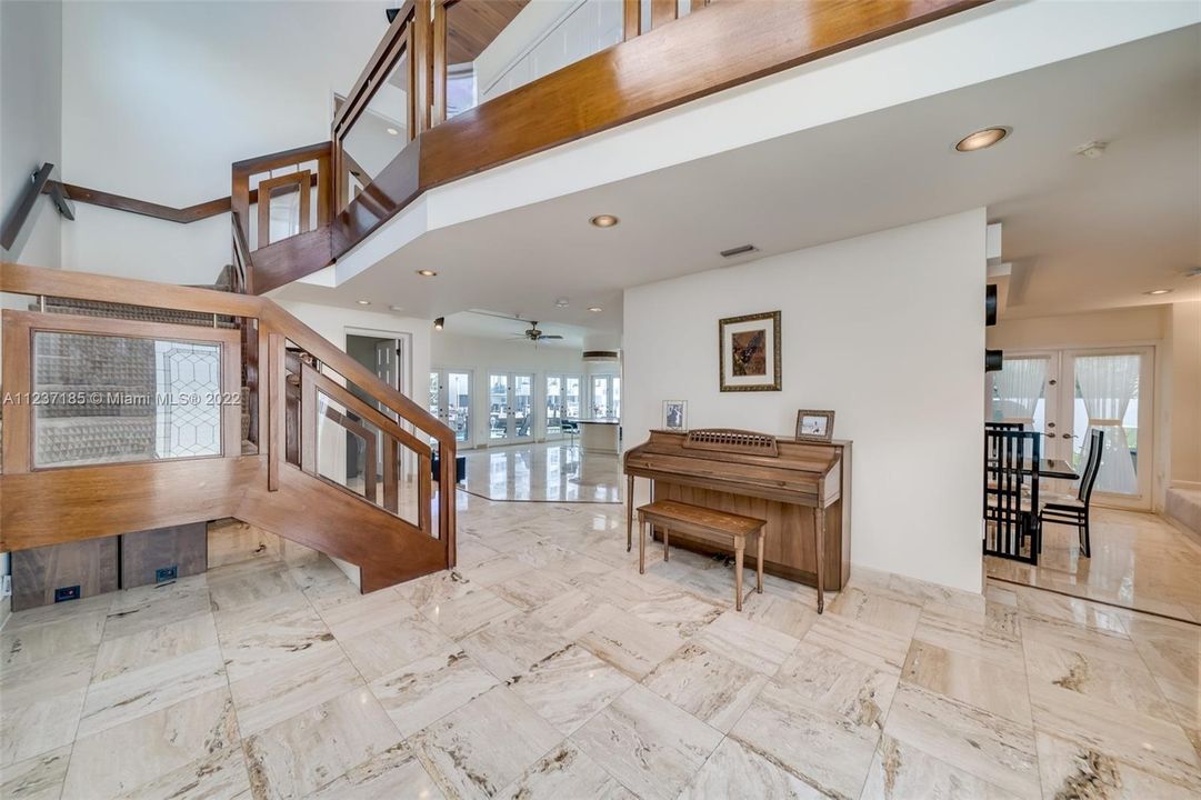 Entryway with high ceilings and views to the great room and waterfront