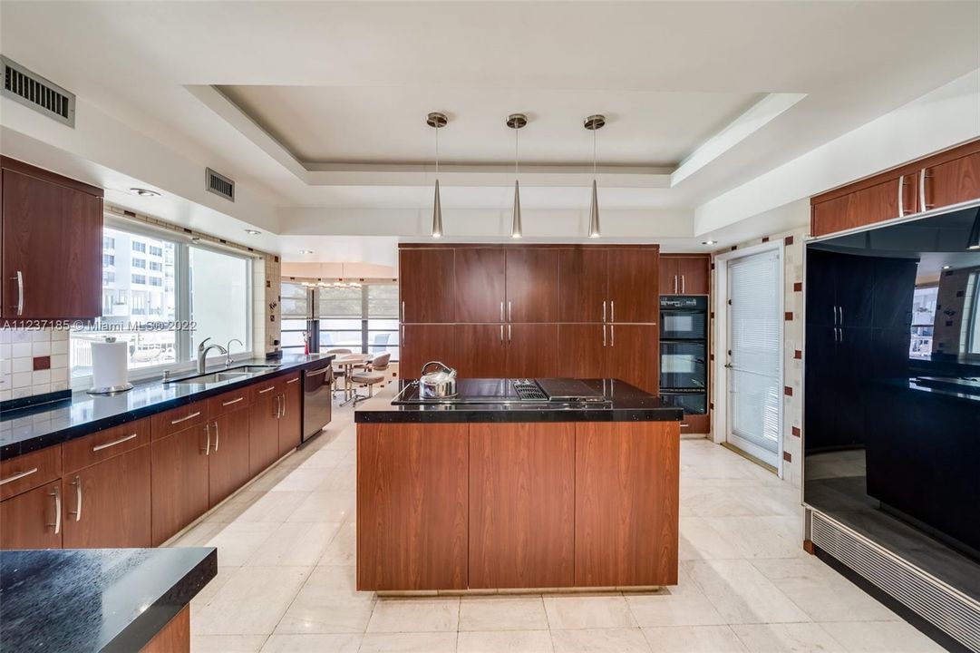 Kitchen with quartz countertops and...
