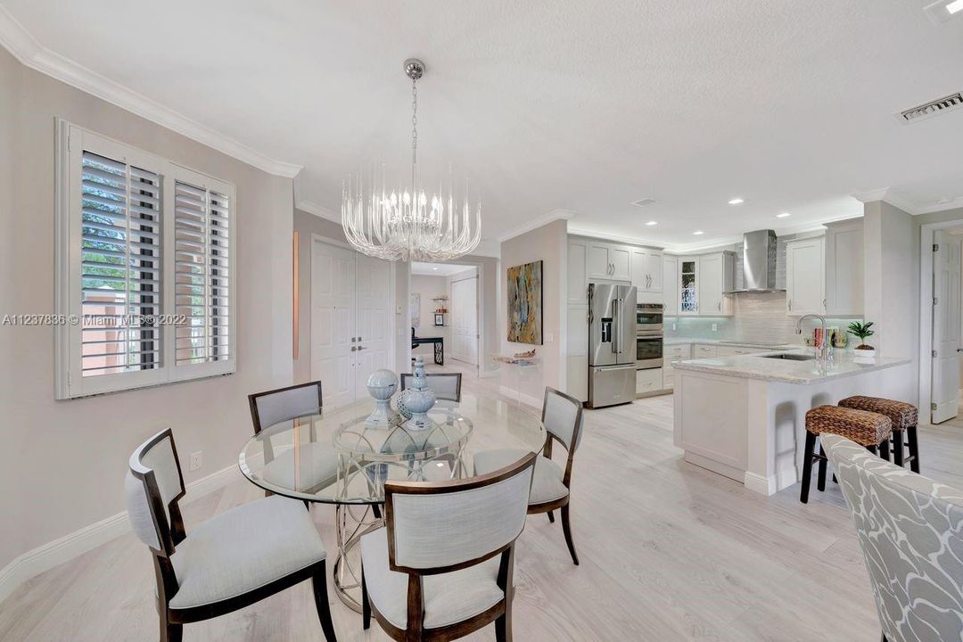 Stunning living space with Austrian laminate flooring. All LED modern square lighting.  Plantation shutters