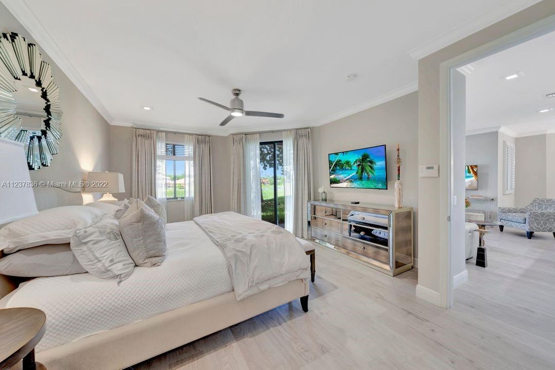 Elegant master bedroom with view of the golf course.