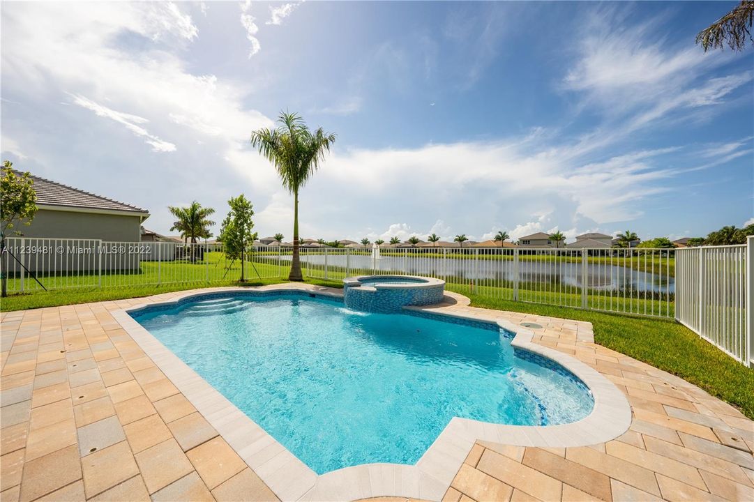 fenced in Patio | Pool with view to the lake