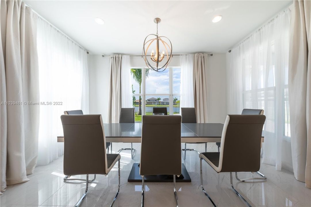 Close-up Dining Room area w/ view to the Lake and Pool |