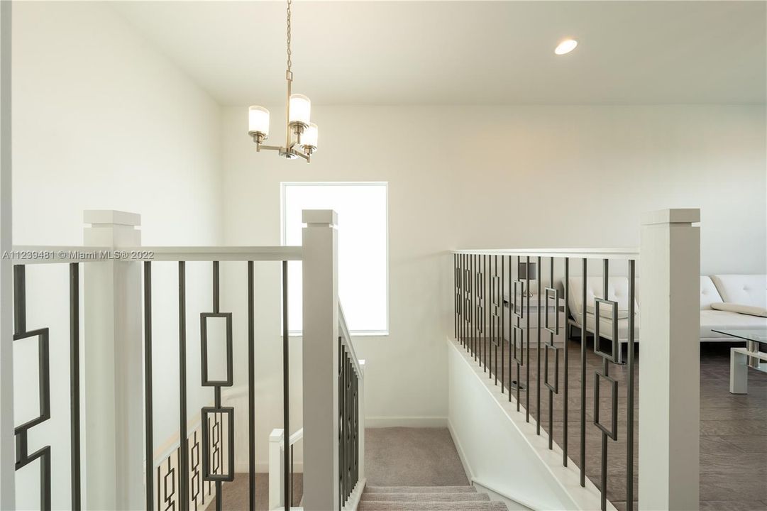 Staircase leading to the second floor and loft area