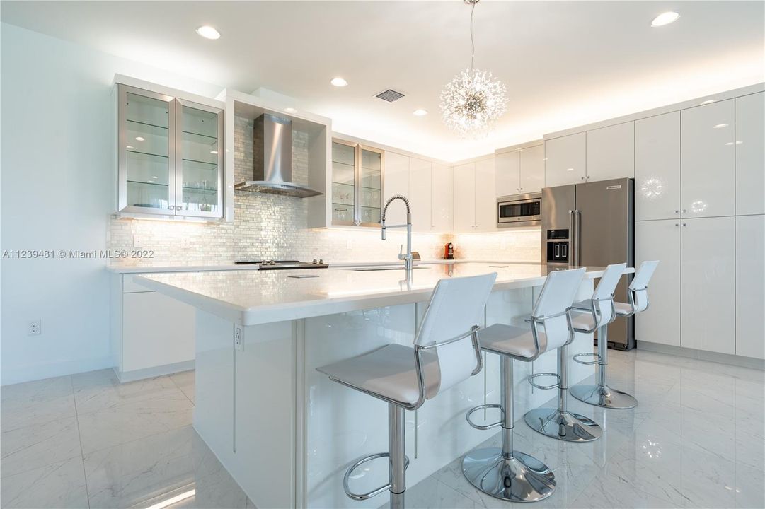 Custom Kitchen Cabinetry | Quartz countertops | Kitchen-aid & General Electric Profile Appliances