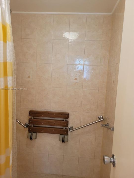 Tiled shower with accessible bench & bars