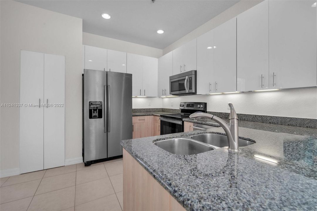 View of pantry and spacious kitchen. Sunken lights.