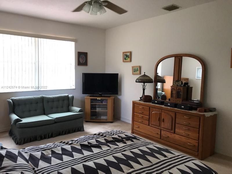 The Primary Bedroom has a nice fan and a dbl window looking Westerly over the deep backyard. This is a very comfortable home that has been very well maintained over the last 23 years.