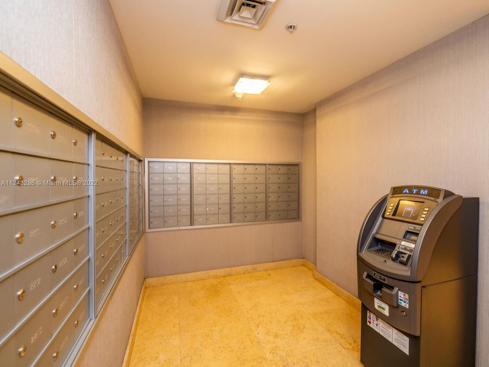 Infinity at Brickell mail room with ATM services.