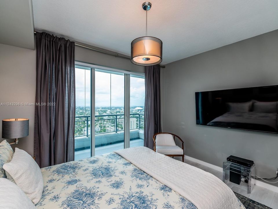 Master suite with Floor to ceiling glass doors with amazing unobstructed views to wake up to every morning.