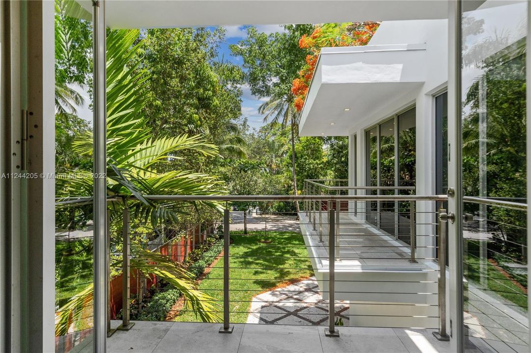 Open balconies offers lush vistas of tropical greenery from every room