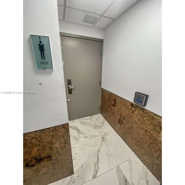 Men's bathroom ADA compliant. The buildings crew cleans it and maintains it