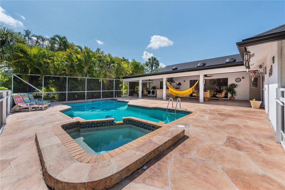 Wonderful Stone patio and double pool to soak in the natural Florida sunlight and warm climate